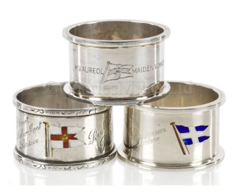 THREE SOUVENIR ENAMEL AND SILVER NAPKIN RINGS comprising Elder Dempster Line 1925; Royal Mail Lines (maiden voyage Port Kings