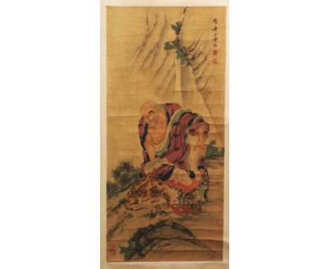 A CHINESE HANGING SCROLL PAINTING ON PAPER, depicting an Immortal in the company of a tiger, the painting itself approx. 36in