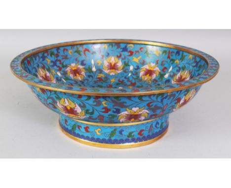 A CHINESE CLOISONNE ENAMEL BOWL, the interior and sides decorated with formal scrolling lotus reserved on a vivid cloisonne g