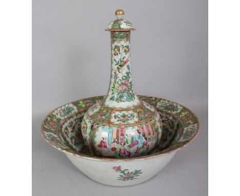 A 19TH CENTURY CHINESE CANTON PORCELAIN WATER BOTTLE, COVER & BASIN, painted in typical palette with panels of figures on ter