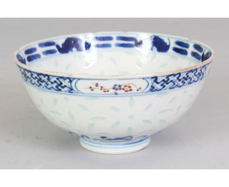 A 19TH CENTURY CHINESE BLUE & WHITE & ENAMEL DECORATED RICE PATTERN PORCELAIN BOWL, the interior painted to its centre with a