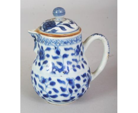 A CHINESE KANGXI PERIOD BLUE & WHITE PORCELAIN SPARROW BEAK PORCELAIN JUG & COVER, the sides painted with rockwork and formal