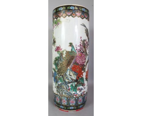 A LARGE CHINESE FAMILLE ROSE PORCELAIN STICK STAND, decorated with exotic birds amidst foliage and rockwork, the base unglaze