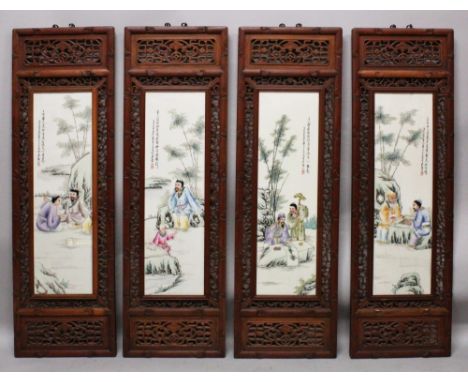 A SET OF FOUR LARGE CHINESE WOOD FRAMED FAMILLE ROSE PORCELAIN PANELS, decorated with scenes of sages and calligraphy, each w