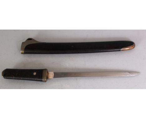 A 20TH CENTURY JAPANESE TANTO, in a lacquered wood scabbard, 16in long overall, the visible area of the blade 8.8in long.