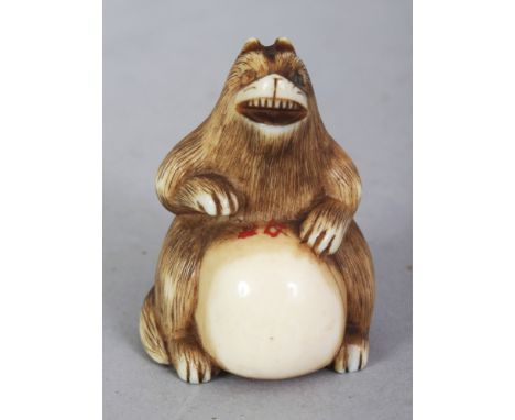 A SIGNED JAPANESE MEIJI PERIOD IVORY NETSUKE OF A BEAR, with a ball-like extended belly, the bear's fur naturalistically engr