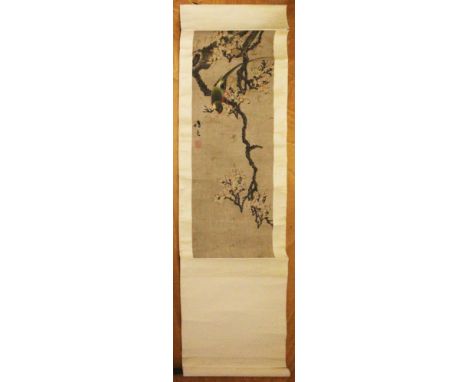 A SIGNED CHINESE SCROLL PAINTING ON PAPER, with calligraphy and artist's seals, depicting a parrot perched on a blossoming br