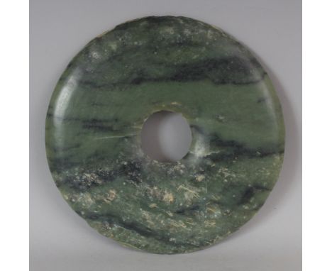 A CHINESE NEOLITHIC STYLE JADE BI DISC, 7.8in diameter.