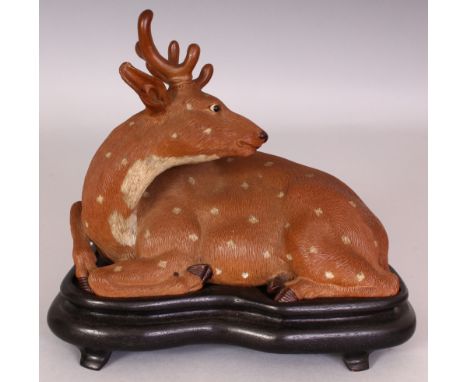 A GOOD EARLY 20TH CENTURY CHINESE REPUBLIC PERIOD PORCELAIN MODEL OF A DEER, together with a fitted wood stand, well modelled