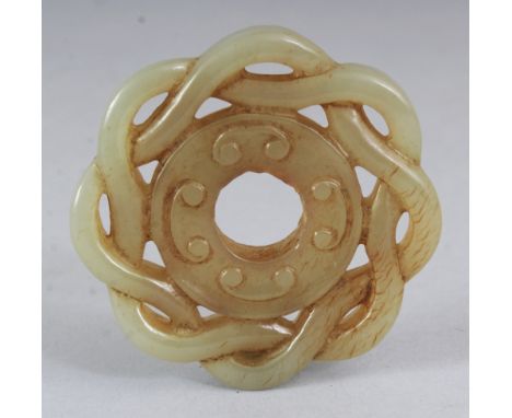 A CHINESE PIERCED CELADON JADE CIRCULAR PENDANT, with a double strand rim, the stone with some russet colouring, 2in diameter