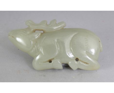 A SMALL CHINESE CELADON JADE CARVING OF A RECUMBENT STAG, 2.7in wide & 1.5in high.