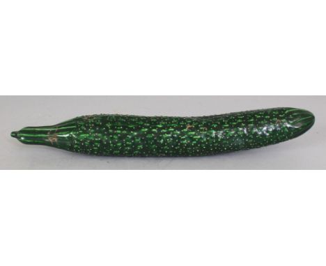 A CHINESE GREEN GLAZED PORCELAIN MODEL OF A CUCUMBER, naturalistically moulded, 12.75in long.