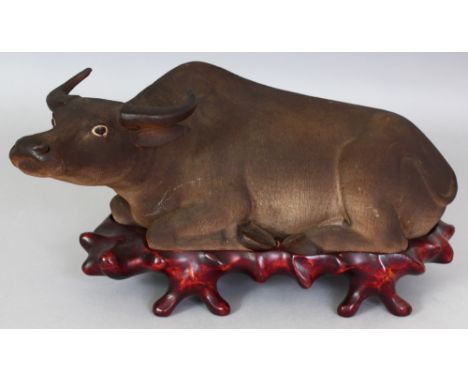 A GOOD EARLY 20TH CENTURY CHINESE REPUBLIC PERIOD PORCELAIN MODEL OF A WATER BUFFALO, together with a fitted wood stand, mode