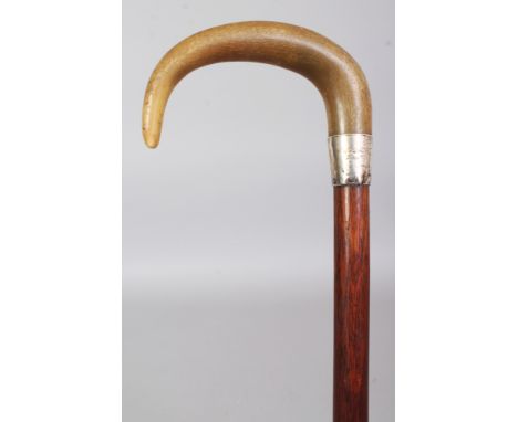 A HORN HANDLED WOOD WALKING STICK, the handle possibly rhino horn, the horn with a tight grain and a yellow-green tone, the s