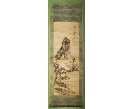 A SIGNED CHINESE SCROLL PAINTING ON PAPER, with calligraphy and artist's seals, depicting two huts in an extensive mountainou