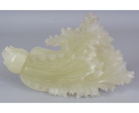A CHINESE JADE-LIKE MODEL OF A LONG LEAFED CABBAGE, naturalistically rendered, 9.6in long.