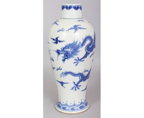 A CHINESE BLUE & WHITE BALUSTER PORCELAIN DRAGON VASE, decorated with two dragons amidst flame and cloud scrolls, the base wi