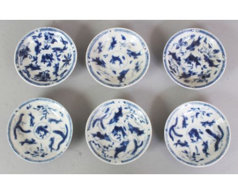 A GROUP OF SIX SMALL CHINESE KANGXI PERIOD BLUE & WHITE PORCELAIN FINGER DISHES, circa 1700, each piece painted with swimming