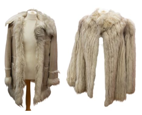 A 1980 cream coney fur long jacket with grey sateen lining, size 36", and long flared sleeves with cuffs. Also a beige sheeps