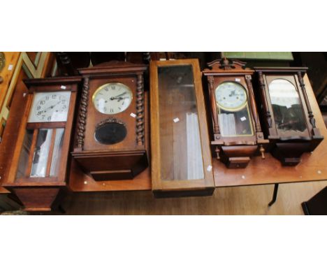 A collection of four early to mid 20th century 8-day wall clocks along with a clock case (5)