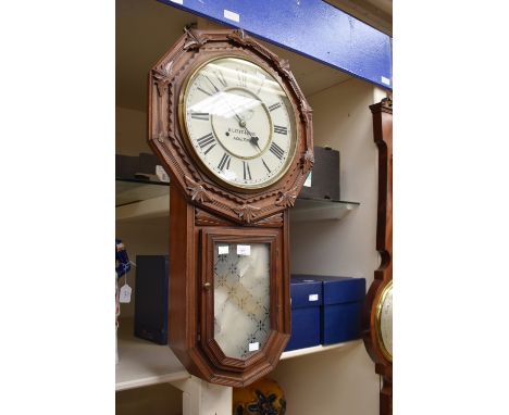 A B. Leefe &amp; Sons of Malton mahogany wall clock with carved detail, American drop dial, deadbeat escapement.