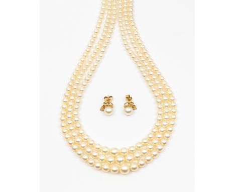 A three row cultured pearl necklace, comprising three graduated rows of round pearls, strung to a sapphire set 9ct white gold