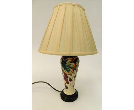 A 20th century Moorcroft table/side lamp with grape and vine detail pattern