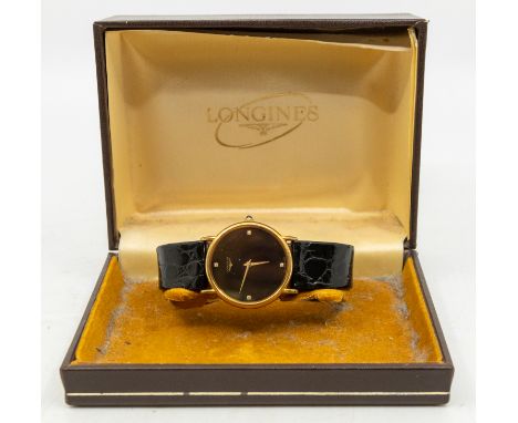 Longines - a gent's vintage gold plated steel cased quartz wristwatch, comprising a black signed  round dial with stone set d