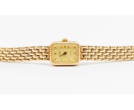 A 9ct gold ladies Rotary quartz wrist watch, comprising a cream rectangular dial, with gilt applied gilt baton markers, case 