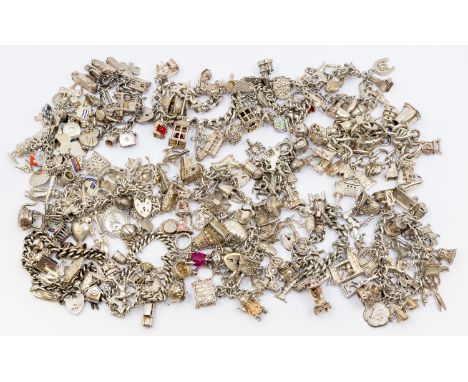 A collection of vintage silver charm bracelets, including various charms including cars, elephant, pram, aeroplane, money, en