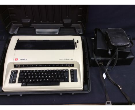 A 1990's cased typewriter plus three sets of modern binoculars
