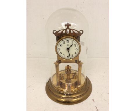 A German 400-day Torsion clock with single train movement, 3" dial, Arabic numerals, with a 'B' printed on it. The movement h