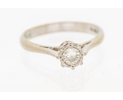 A diamond and 18ct white gold ring, comprising a round brilliant cut diamond approx 0.25ct, illusion set, tapered shoulders, 