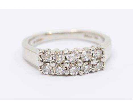 A diamond and platinum dress ring, comprising a double row of round brilliant cut diamonds, total diamond weight approx 1.0 c