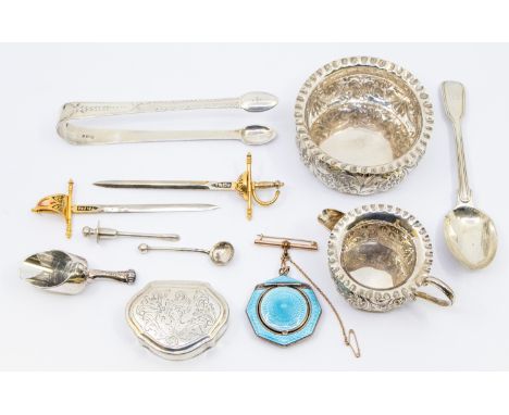 A collection of silver items to include an early 20th century guilloche enamel compact pendant suspended from a rolled gold b