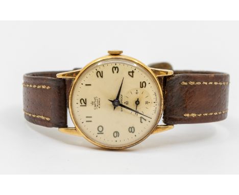 A gents vintage 9ct gold  'Smiths De Luxe' 15 jewel wristwatch, comprising a round signed cream dial with painted black Arabi