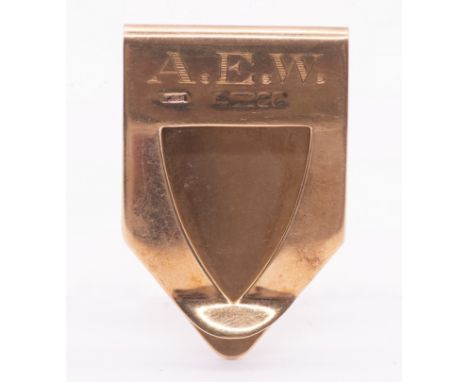 A 9ct gold money clip, comprising a arrow shaped clip with engine turned hobnail decoration, the reverse initialled A.E.W, le