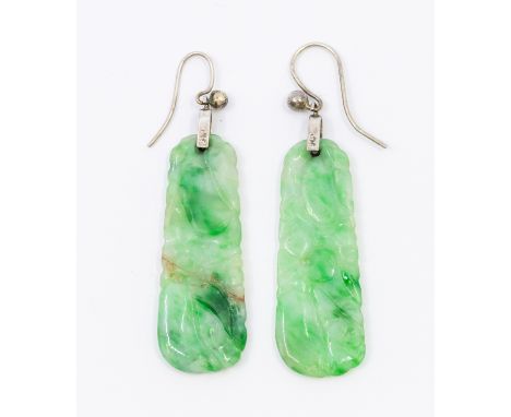 A pair of jade and 9ct white gold crop earrings, comprising a carved jade drop on hook fittings, length approx 40mm, (one cra