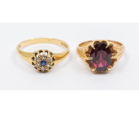 A garnet and 15ct gold dress ring, comprising an oval mixed cut garnet claw set to an engraved shank, size K, total gross wei