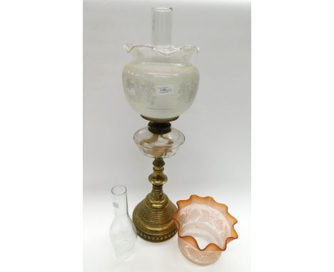 Mid to late 19th Century brass stemmed oil lamp with clear glass oil container, clear and smoked glass etched shade with spar