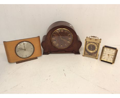 A collection of 20th Century clocks to include; a Metamec teak rectangular form, a Staiger faux bakelite brass clock, Fox &am