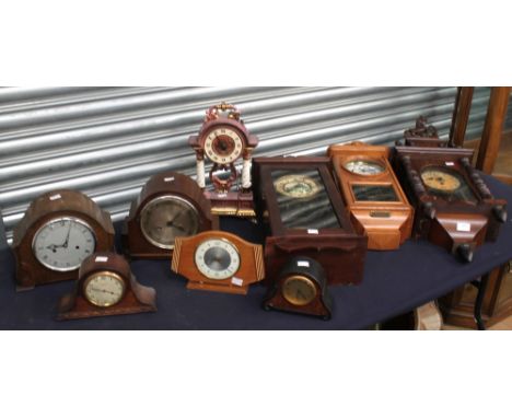 Collection of early 20th century mahogany wall clocks, a ceramic clock, and mid 20th century 8-day mantel clocks. (9)