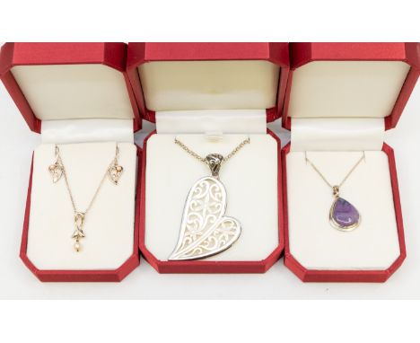 A collection of silver jewellery to include cultured pearl cased pendant and earrings set, amethyst, citrine and blue topaz s