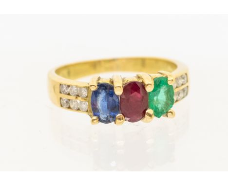 ***AUCTIONEER TO ANNOUNCE CHIPS TO EMERALD ABRASIONS TO STONES*** A three stone sapphire, ruby and emerald, diamond set 18ct 