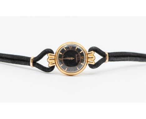 Jaeger LeCoultre: a ladies vintage 18ct gold wristwatch, comprising a round signed black dial with applied gold Arabic hour i