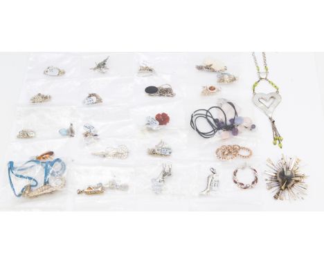 A collection of silver and stone set jewellery to include various brooches, including a stone set violin, marcasite set brooc