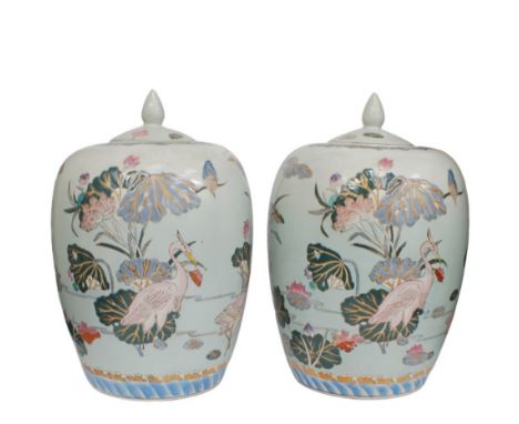 A pair of large 20th century Eastern ceramic jars, with covers and decorated with floral and bird designs. Each approx. 35cm 