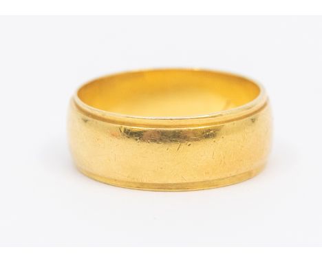 An 18ct gold wedding band, width approx 7mm, size K, weight approx 5gms