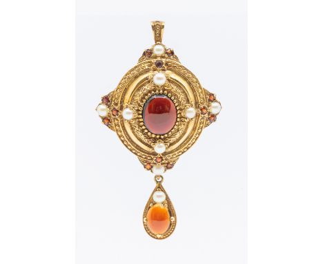 A Victorian style 9ct gold pear and garnet set brooch/ pendant, comprising a domed  form set to the centre with an oval caboc