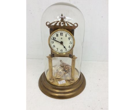 A German Torsion or 400-day clock with single train, spring driven movement with anchor escapement, 3" dial with Arabic numer